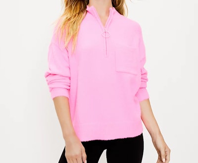 Model wearing pink half-zip sweatshirt 