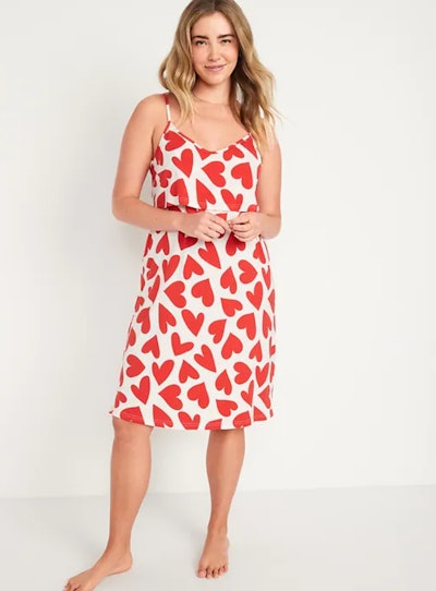 Woman modeling postpartum nightgown; white with red hearts