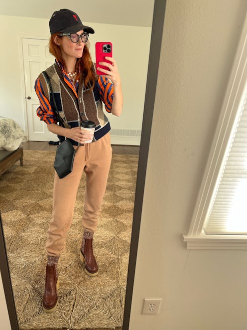 A mirror selfie of Taylor Tomasi Hill wearing leather sock boots by Chloe.