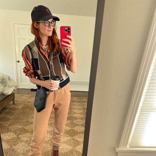 A mirror selfie of Taylor Tomasi Hill wearing leather sock boots by Chloe.