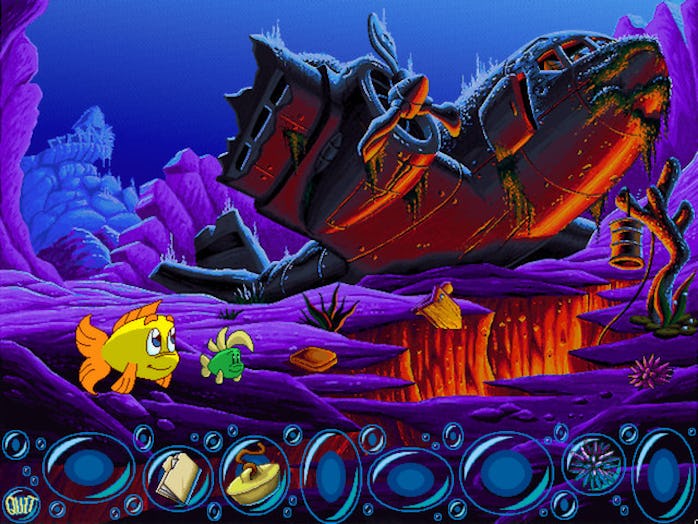 Screenshot of Freddi Fish 3 game showing two fish swimming with sunken, wrecked plane in background ...