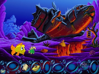 Screenshot of Freddi Fish 3 game showing two fish swimming with sunken, wrecked plane in background ...