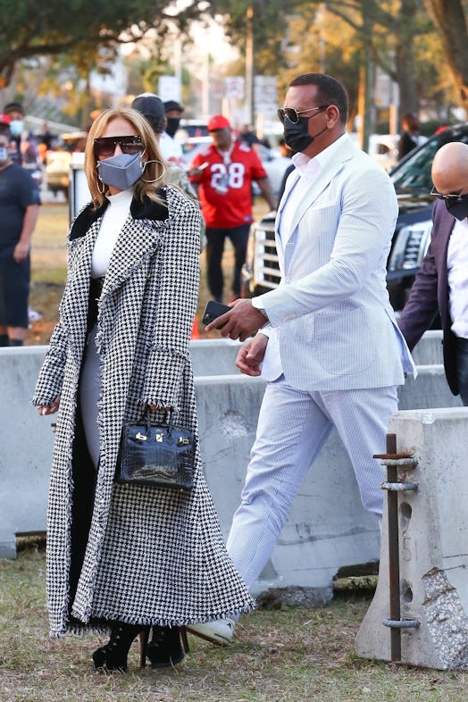 Jennifer Lopez wears houndstooth maxi coat, 2021.