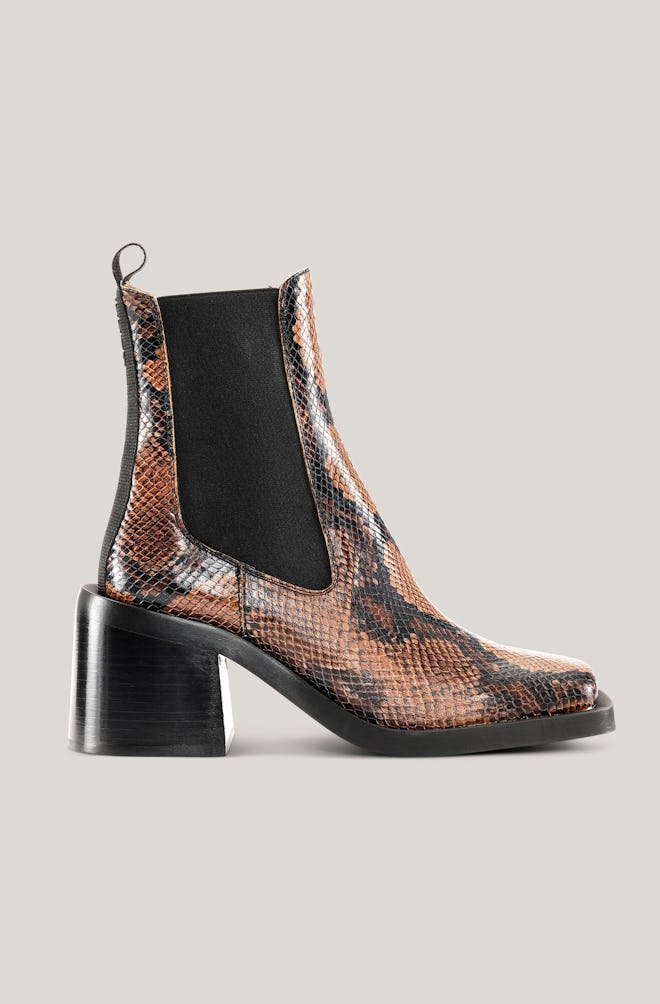 brown embossed snake print heeled chelsea boots by Ganni