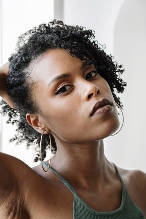 Bustle's editors share the best of December 2021 beauty launches, from a retinol body lotion to a hy...