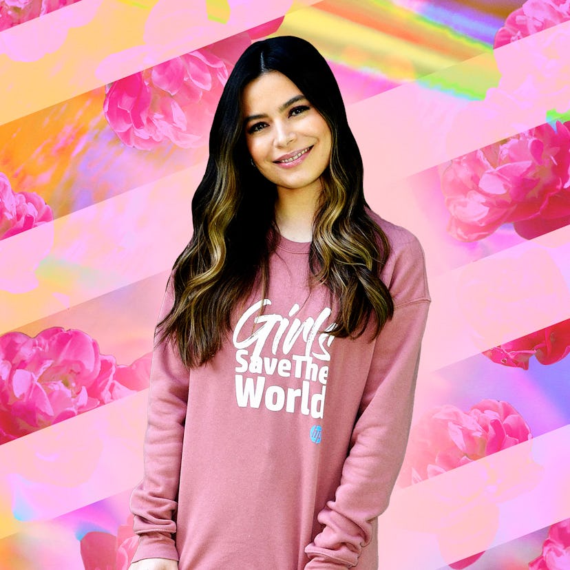Miranda Cosgrove in a "Girls Save The World" shirt in front of a multicolored background