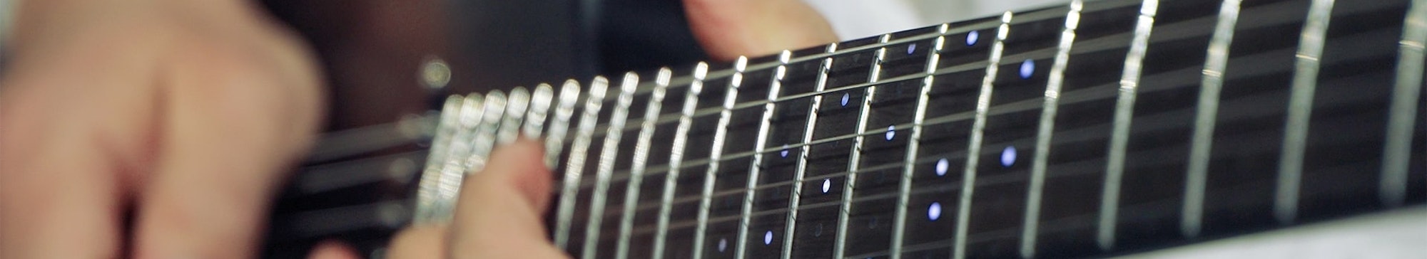 Close-up shot of ZamStar's ZamString smart guitar from Samsung C-Lab