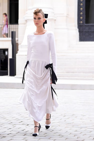 A model walks the runway during the Chanel Couture Haute Couture Fall/Winter 2021/2022