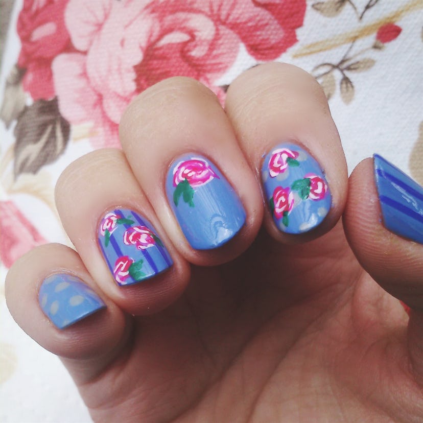 Manicure; blue nails with pink flowers