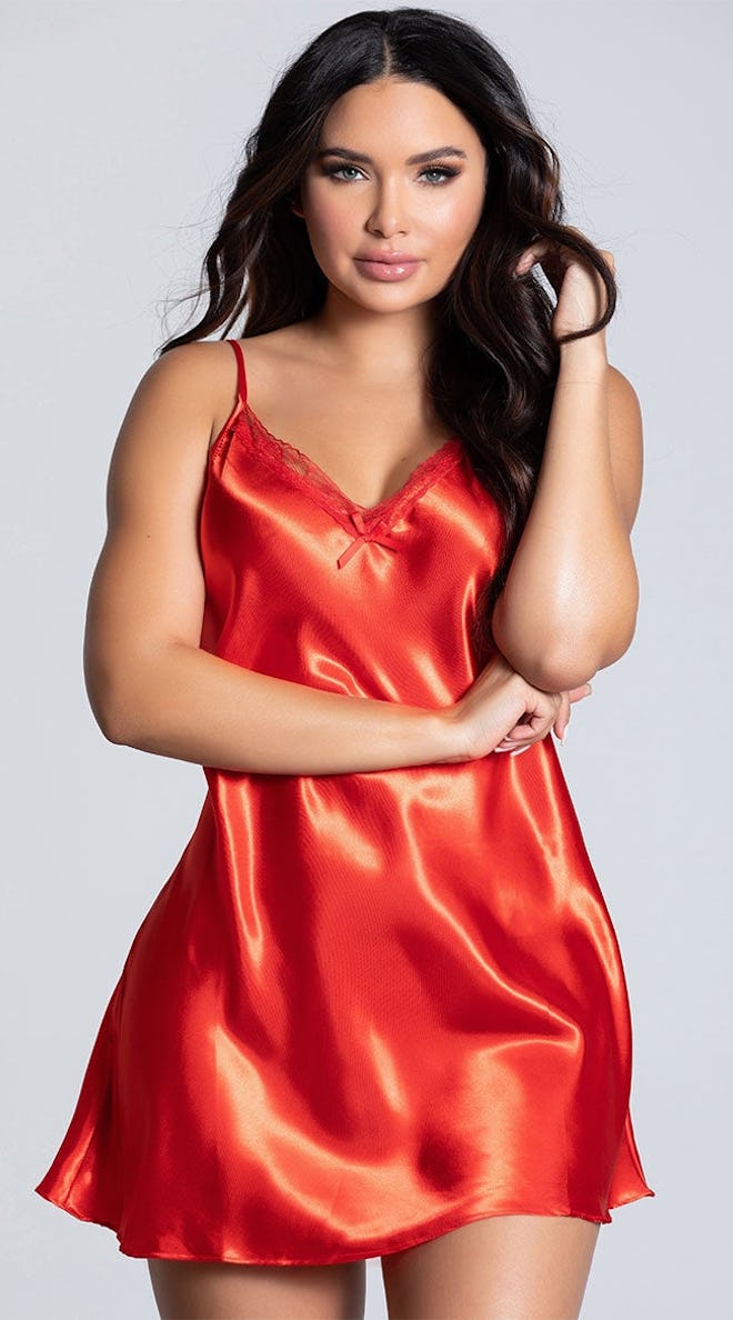 Woman modeling red silky lingerie dress