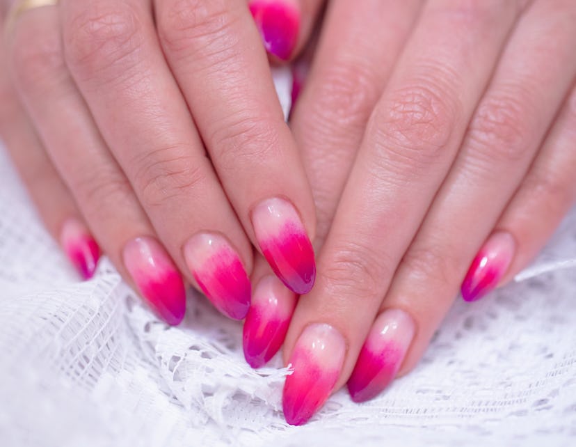 Manicure; varying shades of pink, purple, and red