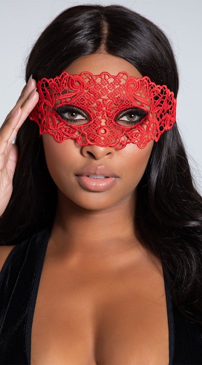 Woman wearing lace red eye mask