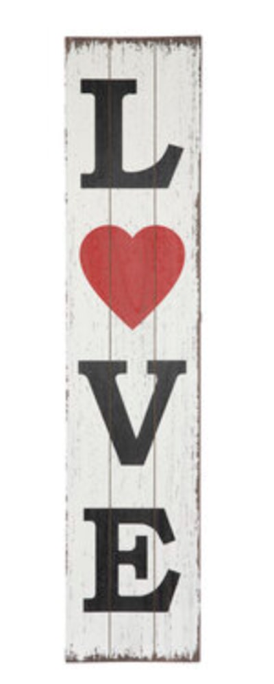 Prop this wooden "love" sign up to welcome guests to your home for Valentine's Day.