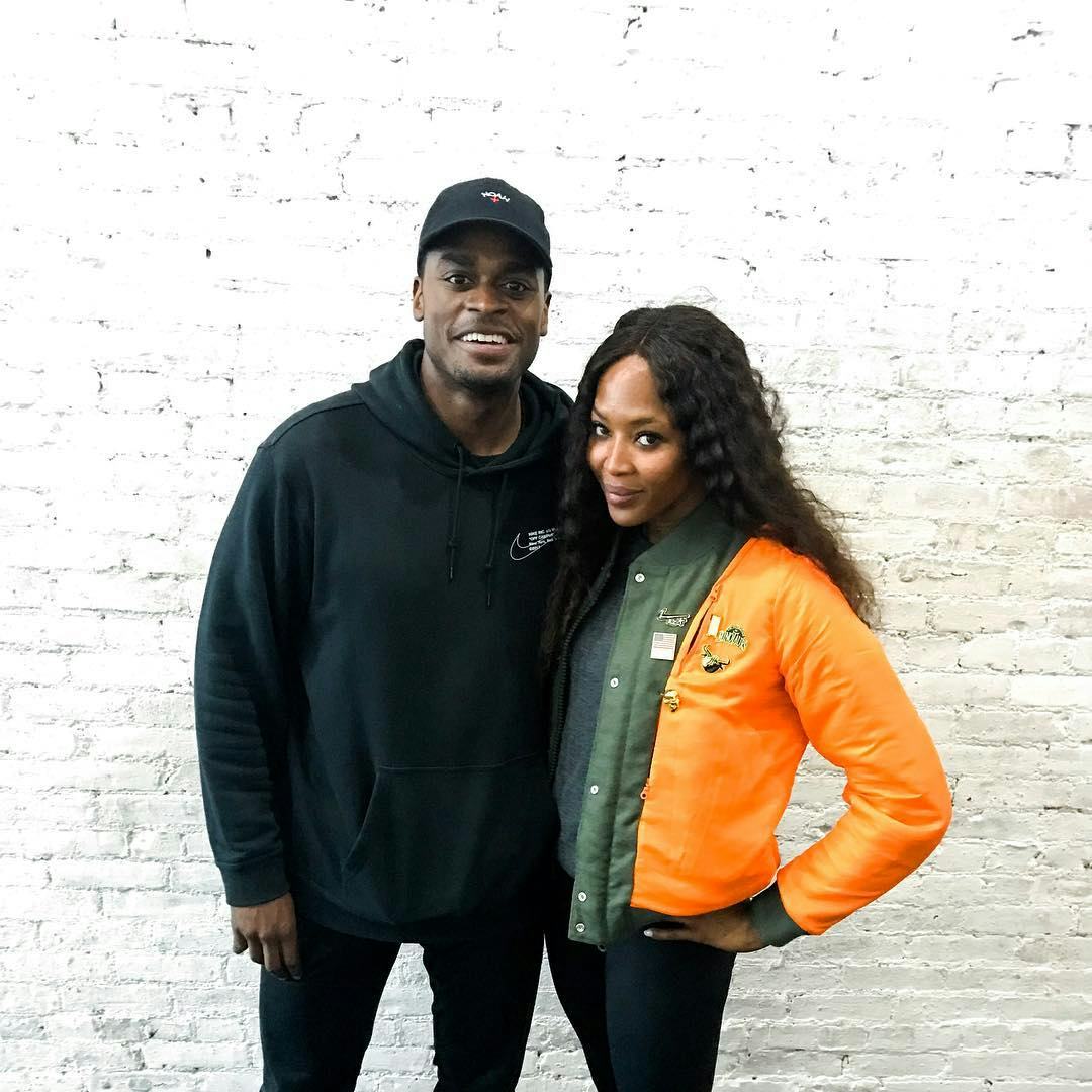 Naomi Campbell and her fitness trainer posing for a photo together