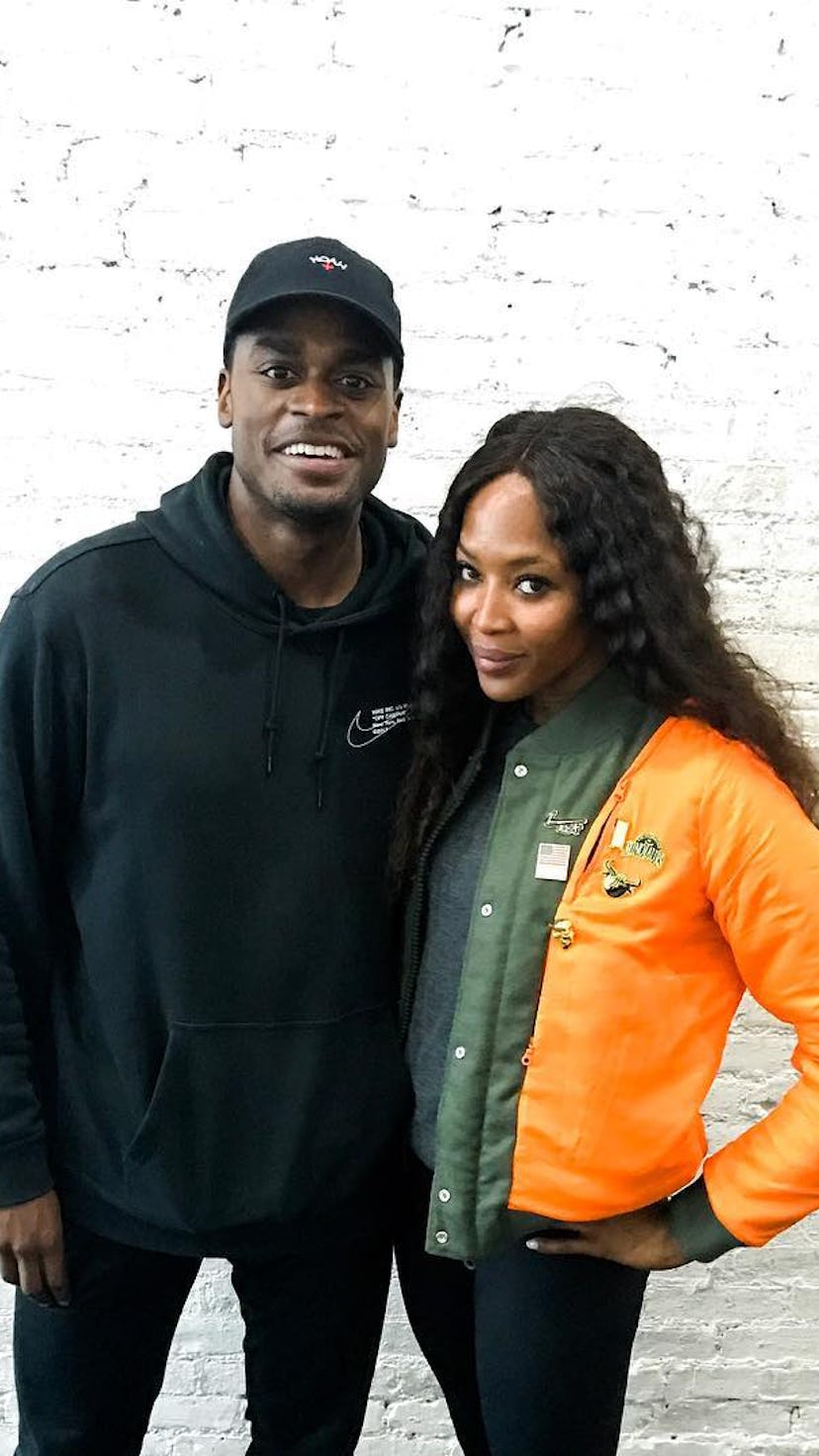 Naomi Campbell and her fitness trainer posing for a photo together