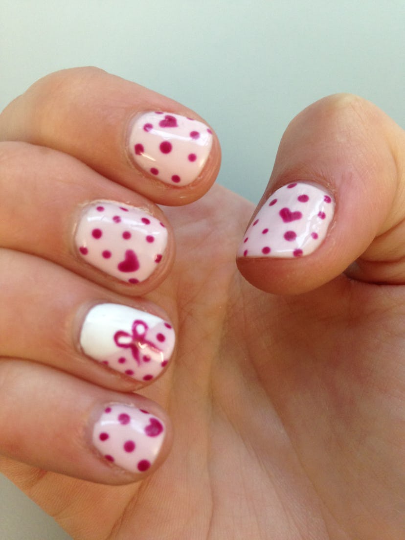 Manicure; white nails with red hearts and polka dots