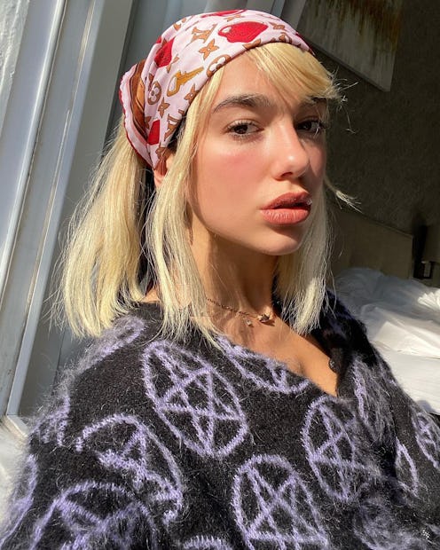 Dua Lipa selfie in a headscarf. 