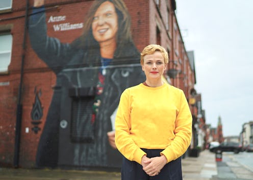 Maxine Peake standing in front of a mural dedicated to Anne Williams