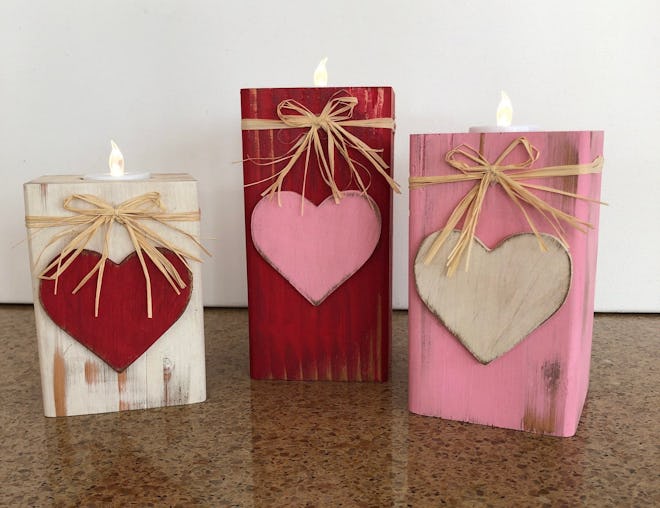 These wooden candle holders are a pretty Valentine's Day decoration.