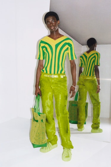 A model in a Bottega Veneta green shirt and pants combination 