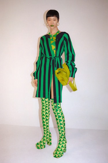 A model in a Bottega Veneta stripy green look