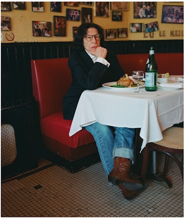 Fran Lebowitz sitting in a restaurant 