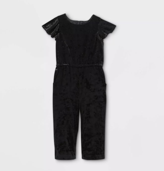 Flat lay of toddler romper in black velour 