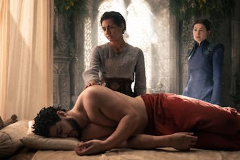 Egwene (Madeleine Madden) and Moiraine (Rosamund Pike) attend to Perrin (Marcus Rutherford) in The W...