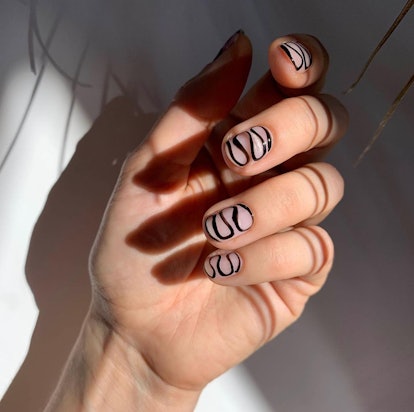 If you're into minimalist nail art, try swirls or different colors of French tips.