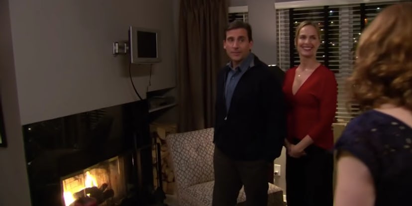 Michael (Steve Carell) shows off his plasma TV to Jim (John Krasinski) and Pam (Jenna Fischer) on an...