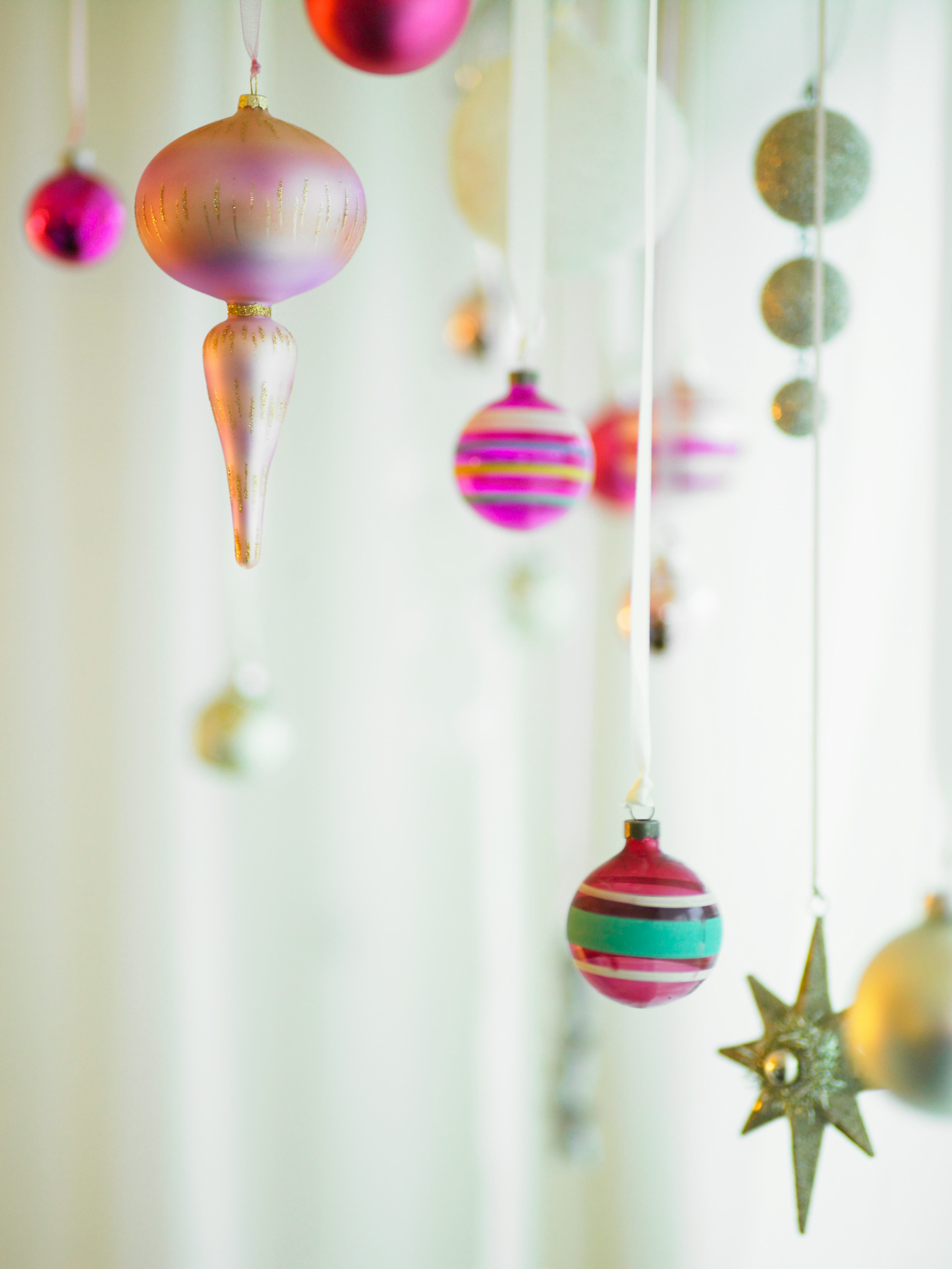 vintage glass ornaments hanging from ribbon
