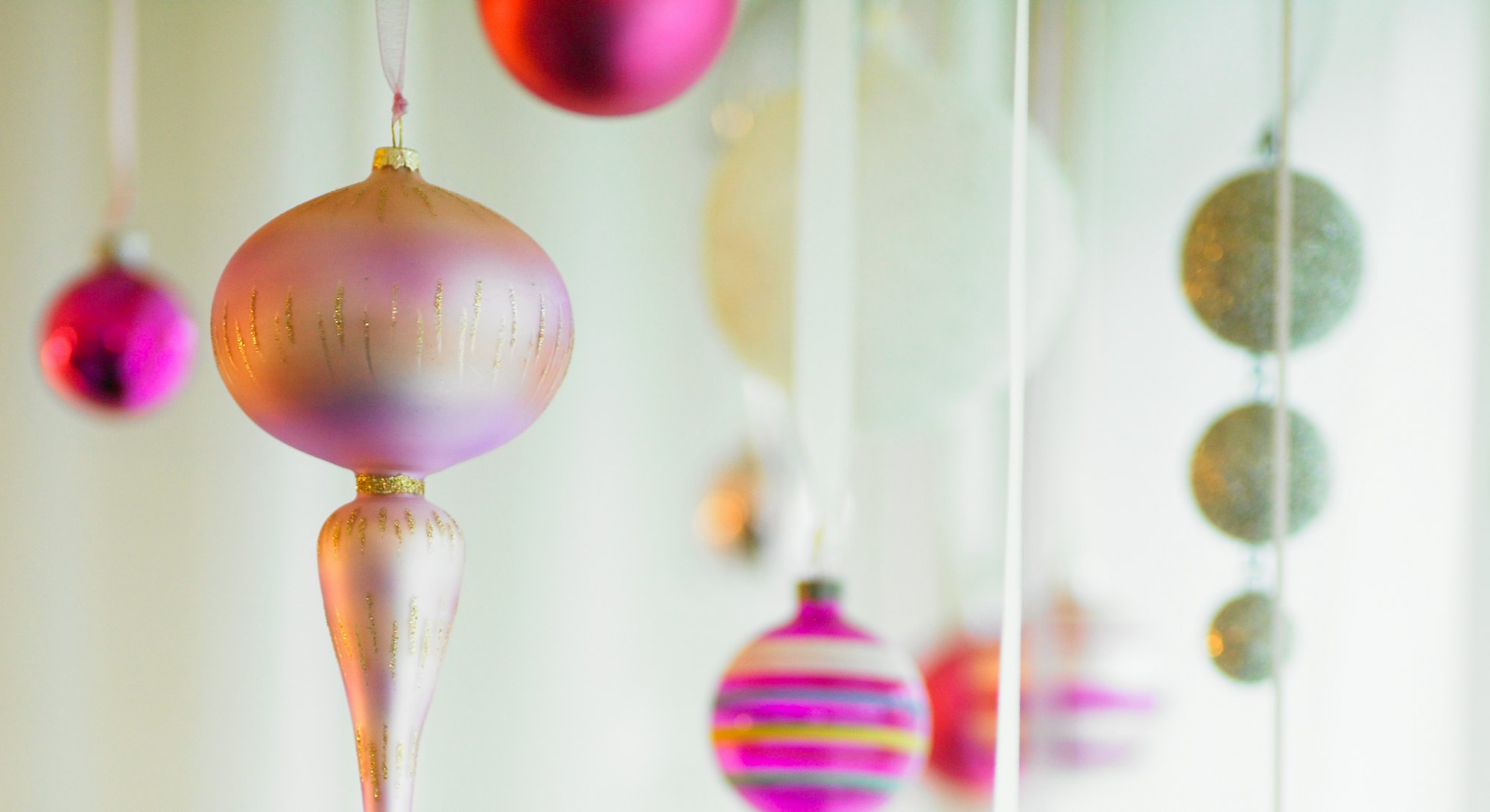 vintage glass ornaments hanging from ribbon