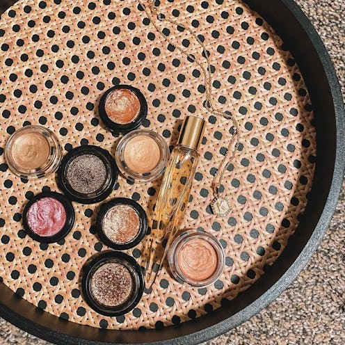 A straw-pleated tray with eight of the best cream eyeshadows for effortless application and a perfum...