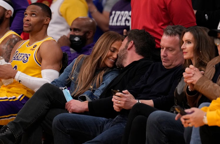 Jennifer Lopez and Ben Affleck during a time out in the first half of a NBA basketball game