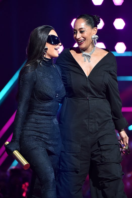 Kim Kardashian West accepting the Fashion Icon of 2021 award from Tracee Ellis Ross