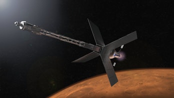 An artist’s conception shows a Mars transit habitat with a nuclear propulsion system.