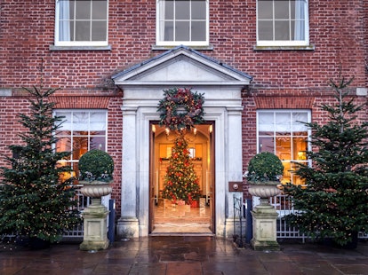 Christmas trees and holiday decorations at the entrance of the Four Seasons Hotel Hampshire