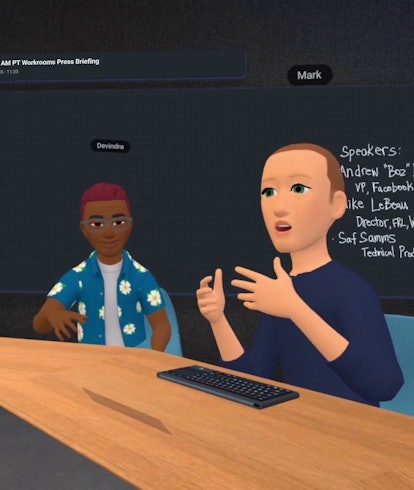 Metaverse Mark Zuckerberg sits at a work desk speaking. 