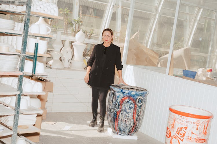 Renata Morales, with her work, at the Cerámica Suro factory.