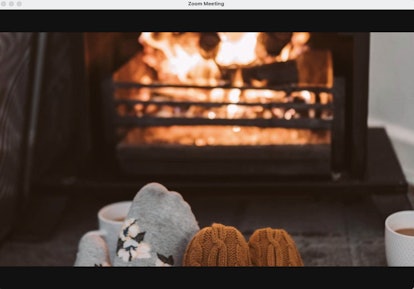 These pretty winter Zoom backgrounds include gorgeous views and cozy fireplaces.