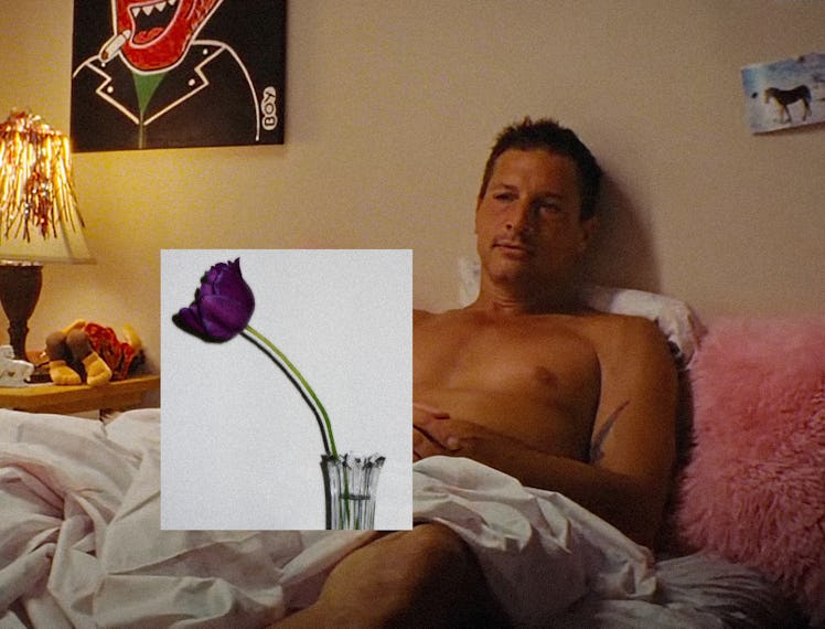 Simon Rex as Mikey Saber in Red Rocket, reclining on the bed