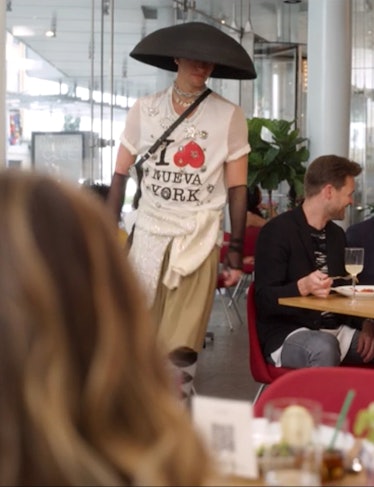 A person wearing a lampshade-shaped hat in And Just Like That