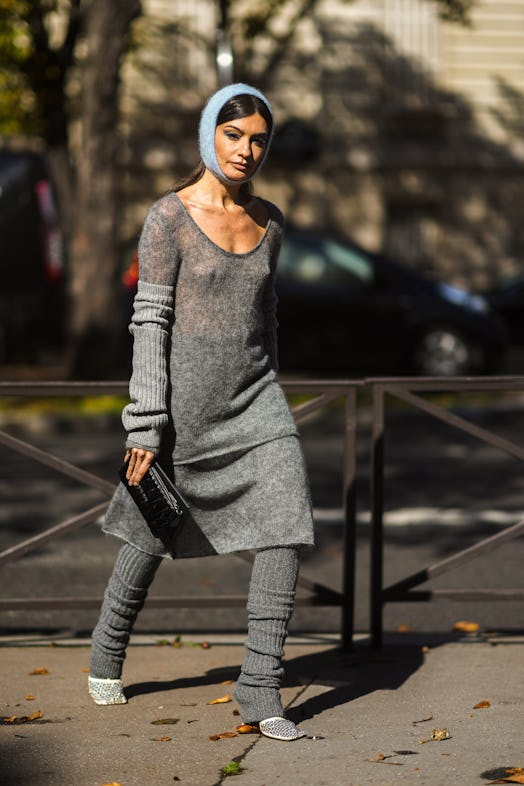 Angela Rozas Saiz wears a blue balaclava, and gray knit sweater set on October 05, 2021 in Paris, Fr...