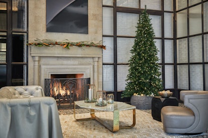 A Christmas tree in a seating area at the Pendry San Diego hotel