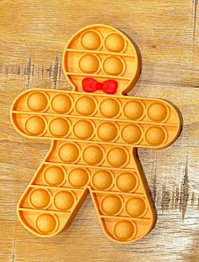 This holiday-themed pop-it is shaped like a gingerbread man.