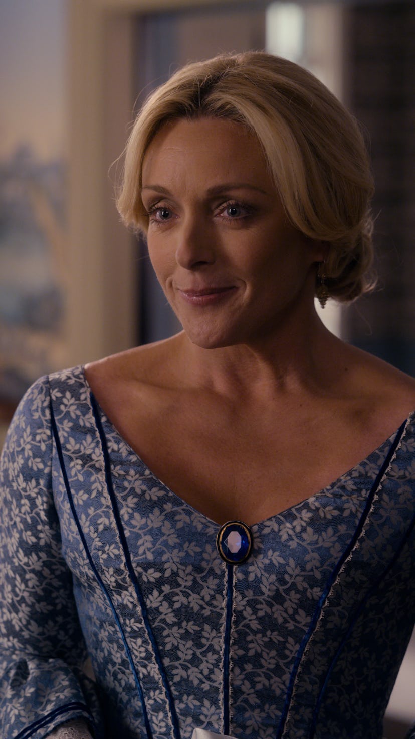 Jane Krakowski smiling as Mrs. Dickinson
