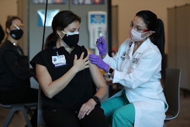 A pharmacist receiving the Pfizer vaccine in Florida.