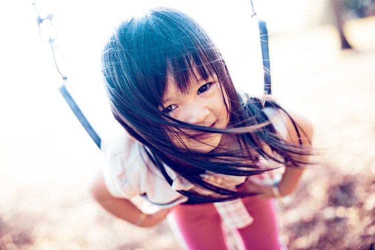 Picture of Asian baby in swing