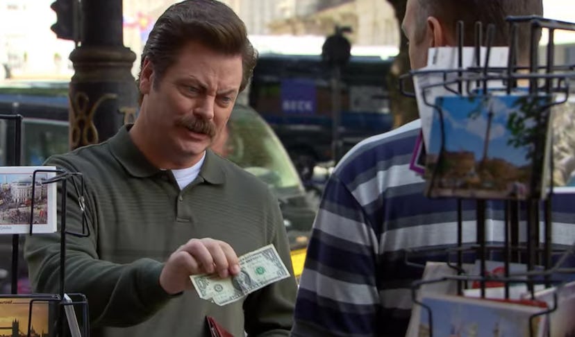 Ron Swanson tries to buy a postcard with a one dollar bill.