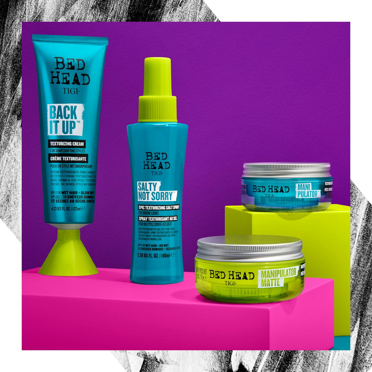 Four out of six new Bed Head by TIGI hair products against a pink and purple back drop.